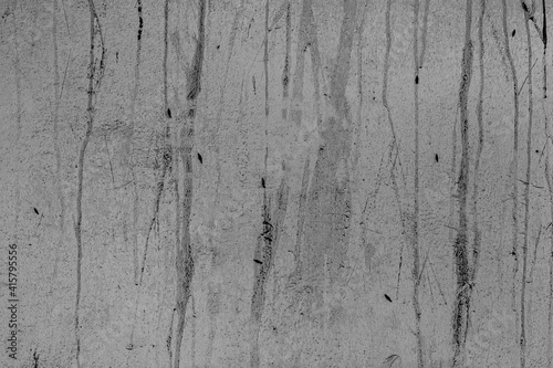 Texture of old dirtied concrete slab smears. Rough bumpy daubs on messy cement cracked floor. Aged dark smudged block, scratched faded worn facade for 3D design. Grungy vintage on decayed chalk panel