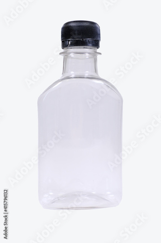 small plastic bottle with black cap isolated on white background