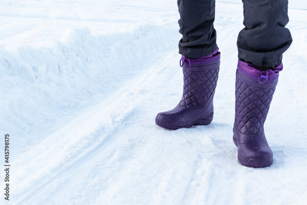 women's lilac winter boots. Winter background. women's lilac winter boots. Winter background.