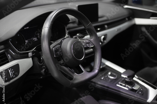 interior of a modern car. Steering wheel, seat, radio, screen..