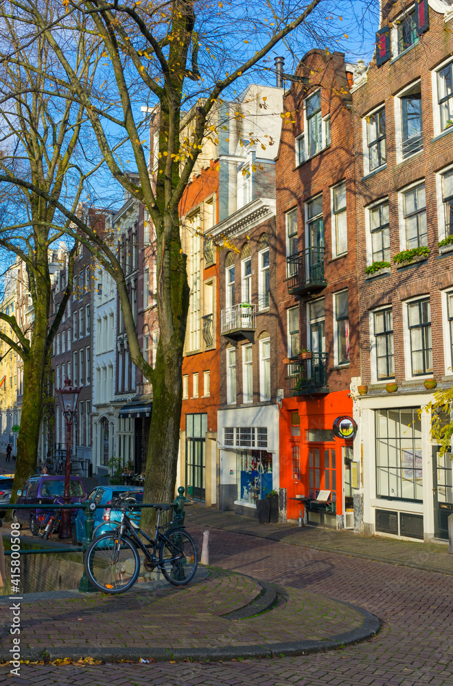 Street view of typical road and house in Amsterdam, Netherlands.