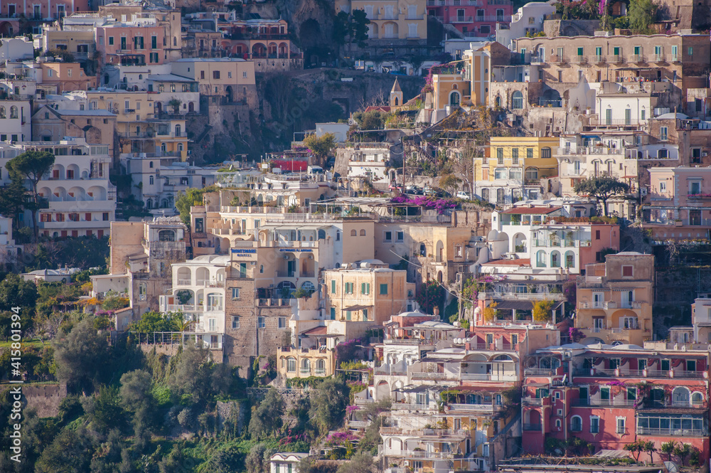 Colored Amalfi houses on hills leading down to coast, Campania, Italy.