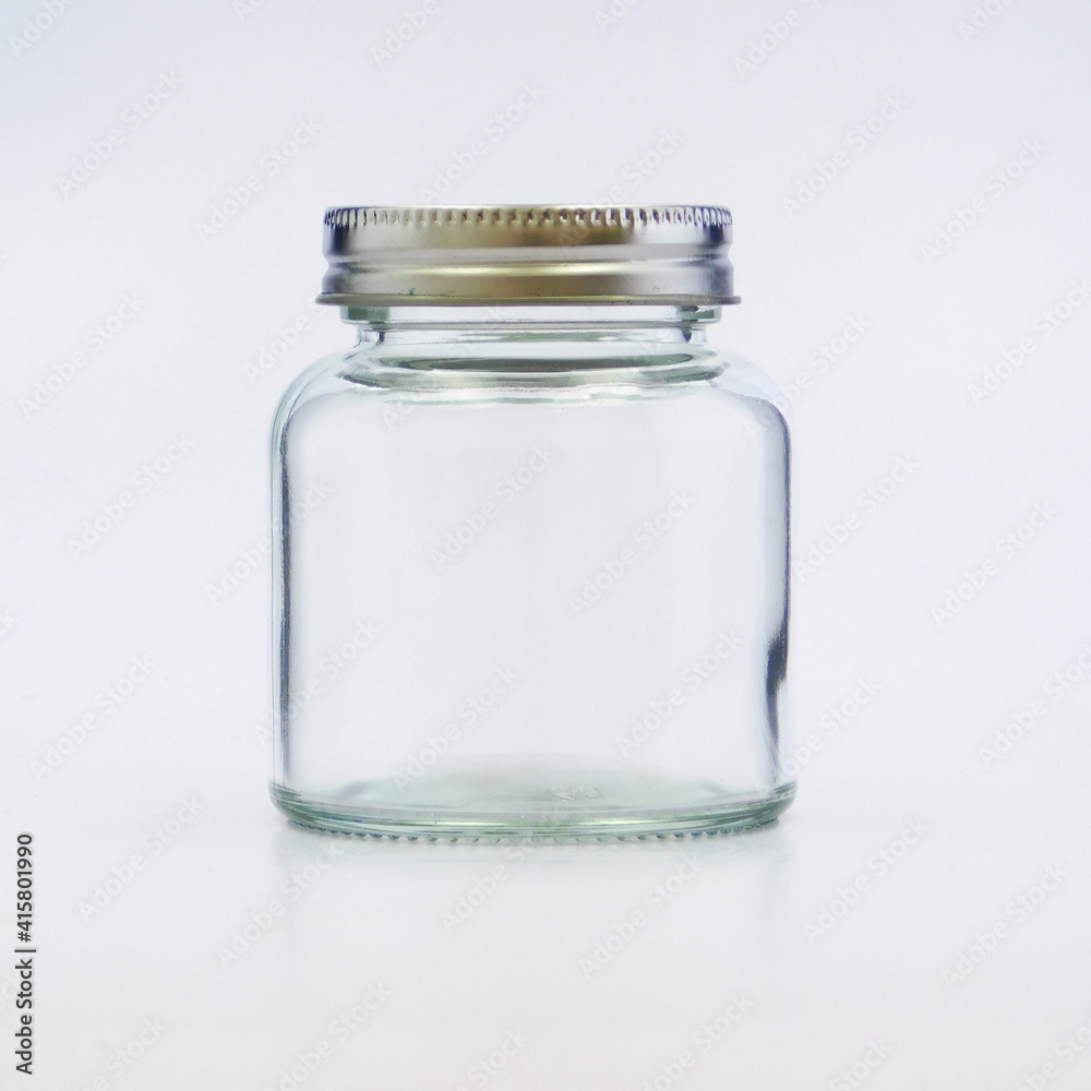 clear tall glass jar with silver lid, transparent, sparkly and brilliant, for food, liquids, sauces, grain, condiments, seeds, preserves and candys, also for decoration
