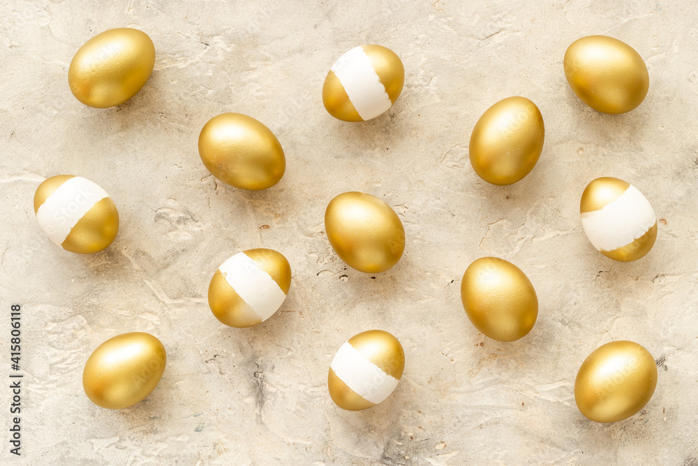 Pattern of golden eggs. Easter decoration. Wealth and good luck concept. Overhead view