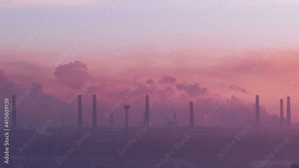 Heavy industry background. Chimneys time lapse. The industrial landscape dawns. Heavy industry background. Chimneys time lapse. The industrial landscape dawns.
