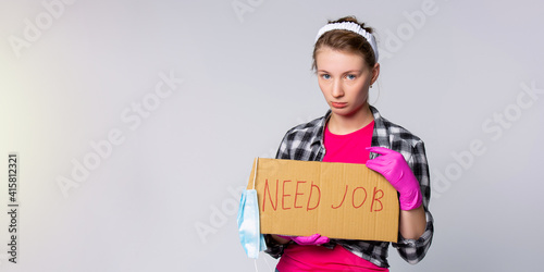 Banner. Sad, dizzy, caucasian woman, a cleaning maid search a new workplace after pandemic quarantine. Need a job placard with medical protective mask on gray background with advertising area