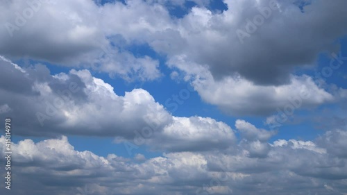 Blue sky white clouds. Puffy fluffy white clouds. Cumulus cloud cloudscape time lapse. Summer blue sky time lapse. Nature weather blue sky. White clouds background. photo