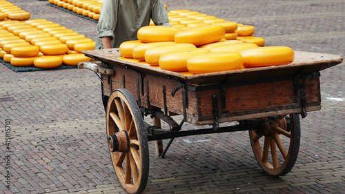 Lots of cheese at a festival in Holland. Cheese cart.