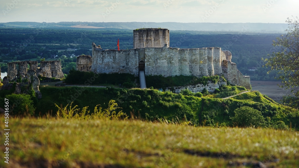 An ancient castle among the green plains of France. 