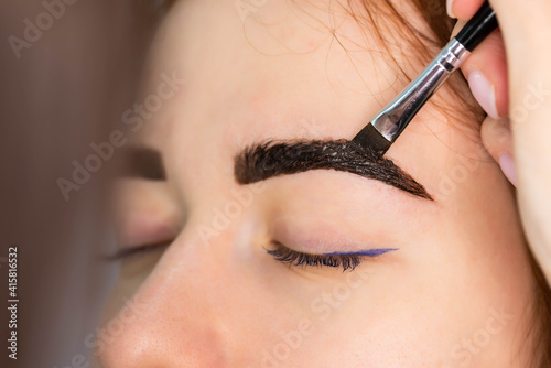Фотография Young Caucasian Woman on the brow beauty procedures