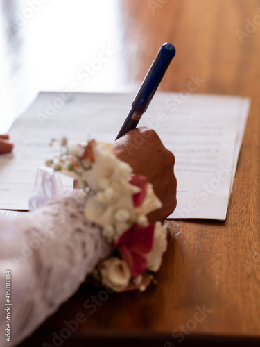 lesbian couple signing their wedding