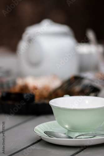 tea time served table with cup and bakery
