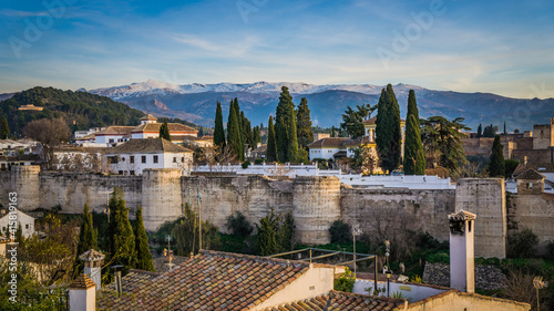 View on the fortification protecting the Albaicin historic district of Granada and tne snow capped Sierra Neveda mountains (Andalusia, Spain) photo