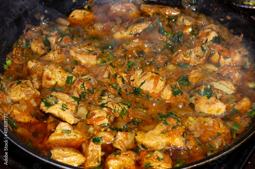 pork fillet stewed in a pan, goulash