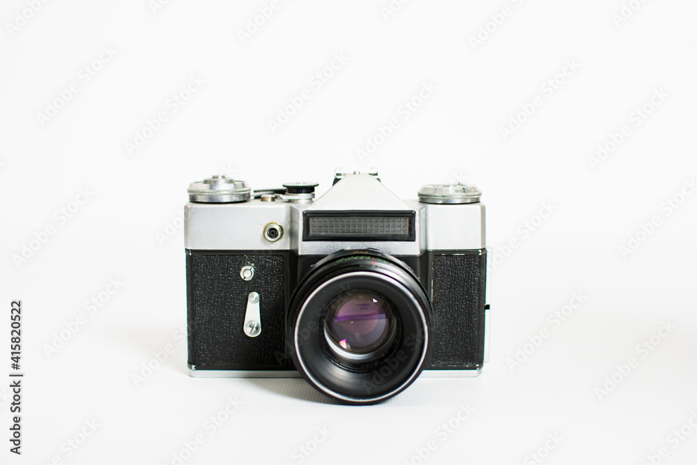 Old film camera isolated on white background with copy space.