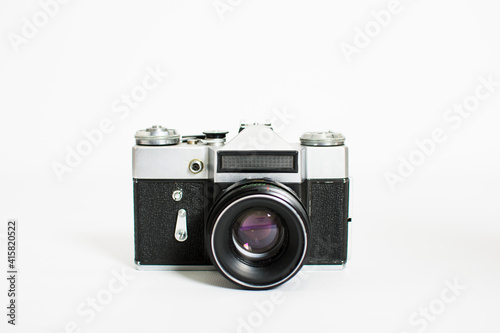 Old film camera isolated on white background with copy space.