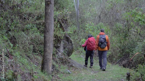 Couple walking in the forest, inca trail, peruvian trekk, road to vilcabamba, machu picchu photo