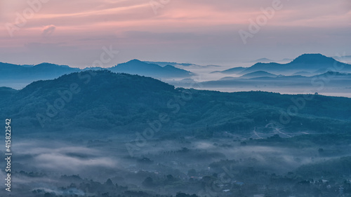 Morning in the mountains. Fog covering the mountain forests. © kaipungyai