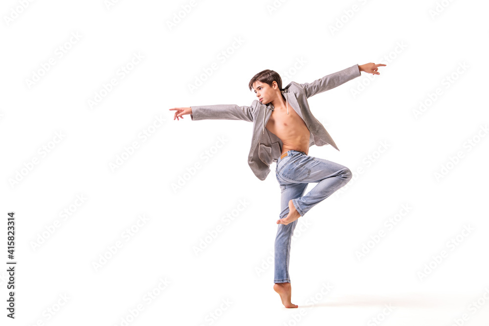 A teenage ballet dancer poses barefoot, isolated on a white background. A teenage ballet dancer poses barefoot, isolated on a white background.