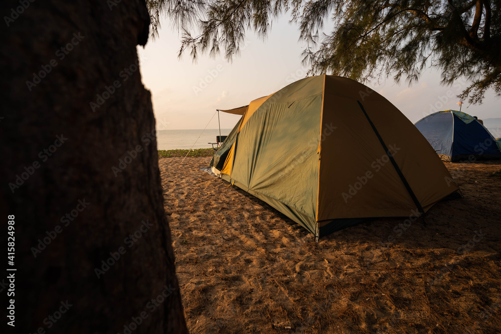 A tourist's tent is at the beach in the morning, time to enjoy nature.