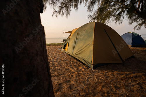 A tourist's tent is at the beach in the morning, time to enjoy nature.