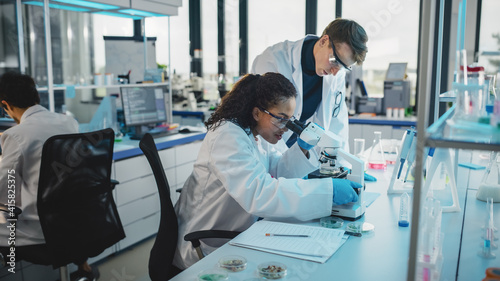 Modern Medicine Laboratory  Diverse Team of Multi-Ethnic Young Scientists Analysing Test Samples. Advanced Lab with High-Tech Equipment  Microbiology Researchers Design  Develop Drugs  Doing Research