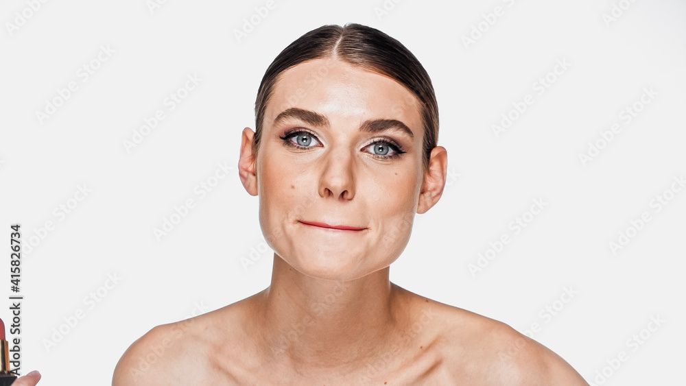 young woman with naked shoulders and makeup grimacing isolated on white young woman with naked shoulders and makeup grimacing isolated on white