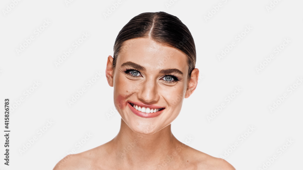 happy woman with smudged lipstick on face isolated on white happy woman with smudged lipstick on face isolated on white