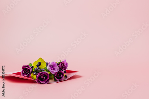 Artificial purple rose bouq...