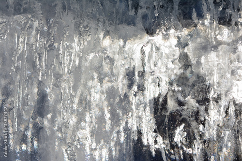 Abstract image of a piece of ice and light penetrating through it, close-up