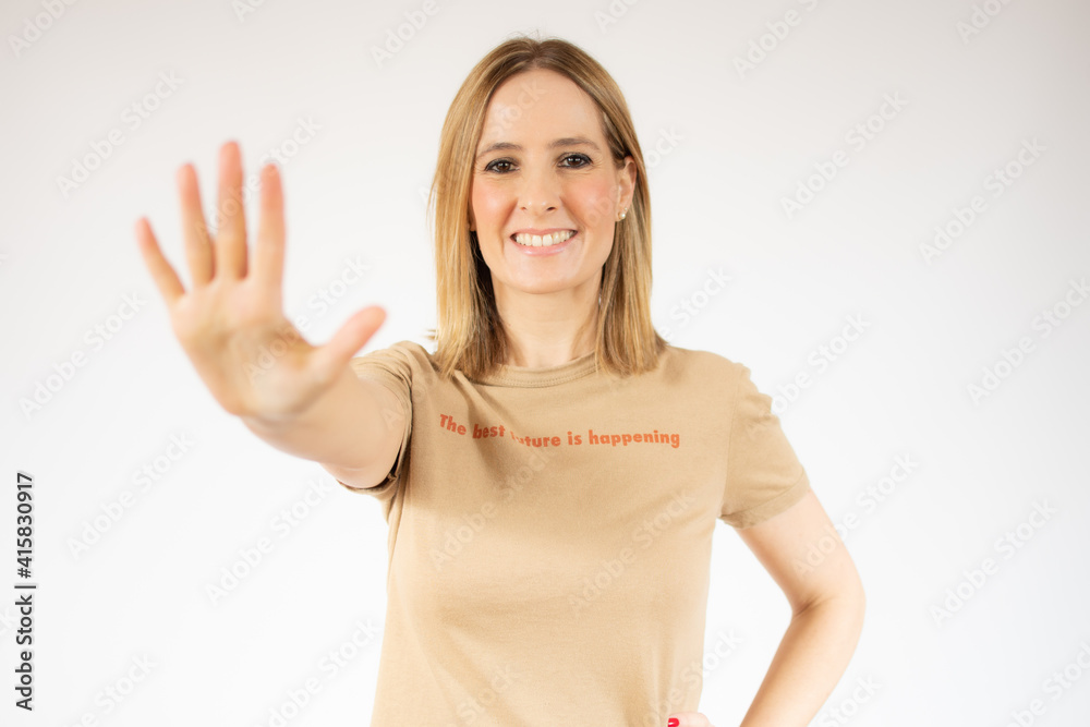 Young woman over isolated white background happy and counting five with fingers