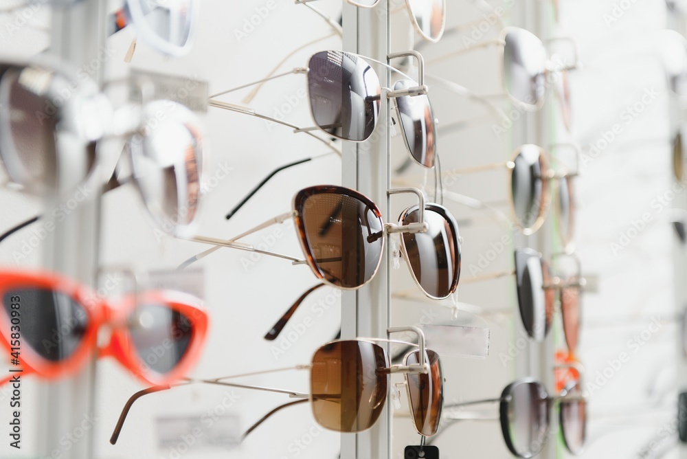 rack with glasses and sunglasses close up rack with glasses and sunglasses close up