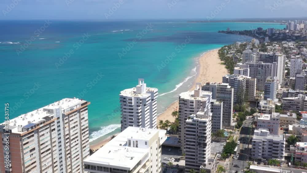San Juan Puerto Rico Condado Parroquia Stella Maris Catholic Church Cinematic Drone Shot with colorful beach and cristal clear sky 2