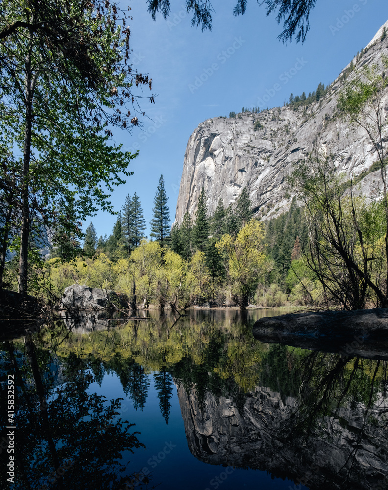 View of El Capitan from the base of a river during the summer in Yosemite, California, USA