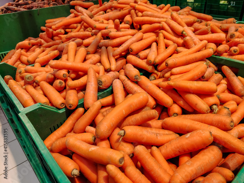Carrots are in boxes in the supermarket
