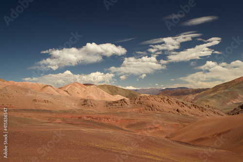 Arid desert landscape high in the Andes mountain range. View of the dunes, brown land and colorful mountains in Laguna Brava, La Rioja, Argentina.