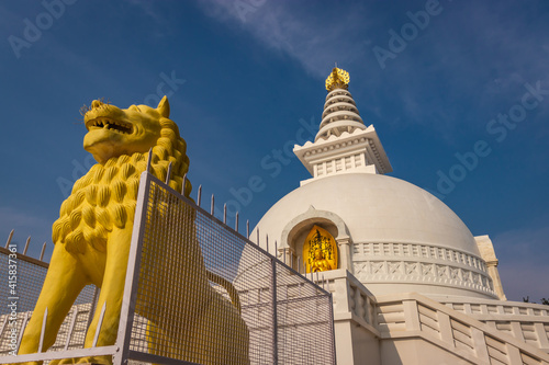 buddhist stupa isolated with amazing blue sky from unique perspective photo