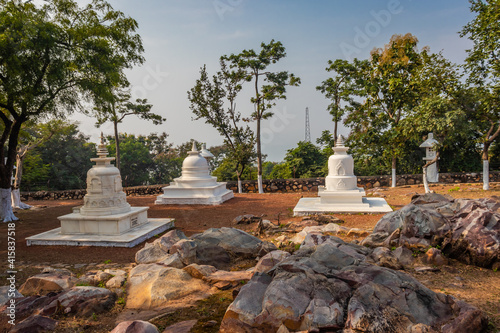 buddhist stupa isolated with amazing blue sky from unique perspective photo