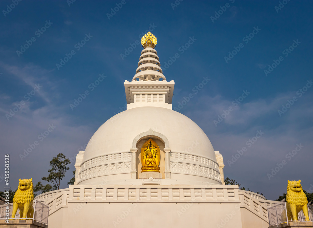 buddhist stupa isolated with amazing blue sky from unique perspective