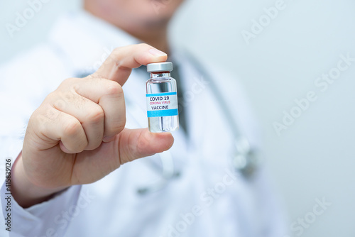 Doctor holds medicine for coronavirus.