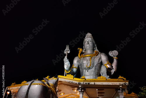 huge shiva statue isolated with black background photo