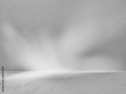 Gray background for product presentation with sunlight glare