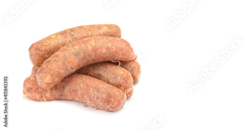 Raw pork sausages. Grilled sausages, spices close-up, isolated on a white background.Selective focus.