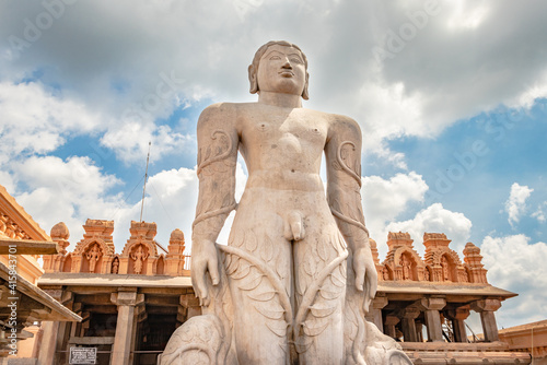 idol of a deity stone statue symbolizing Peace in Jainism with blue sky from different angles photo