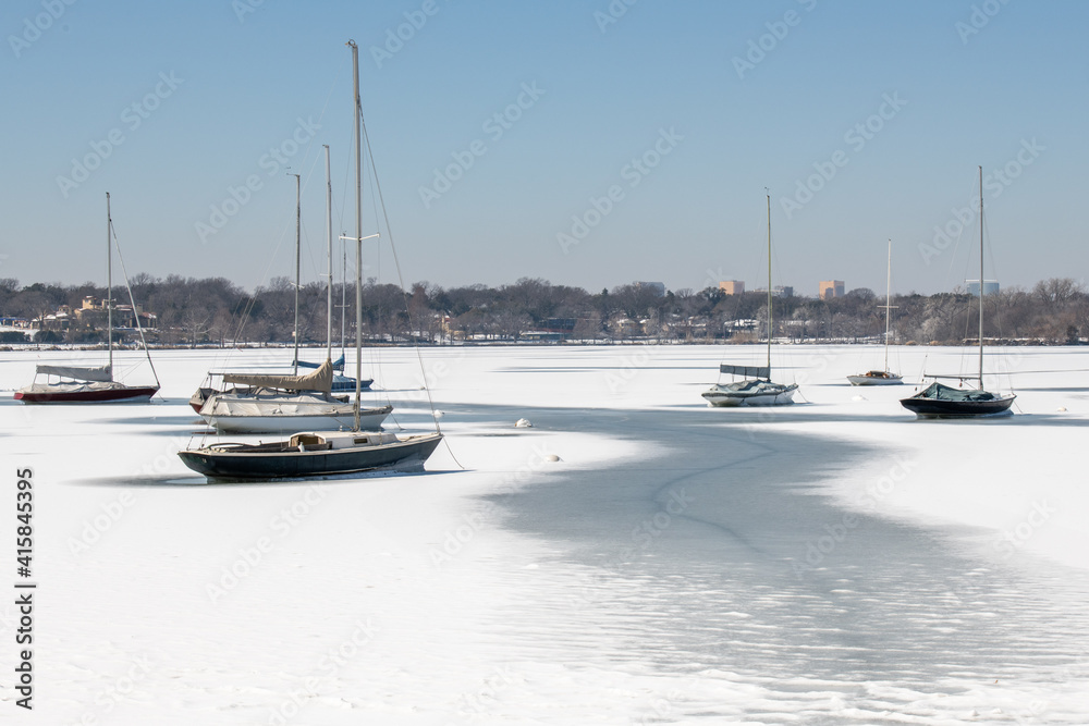 Sailboats on a frozen White Rock Lake in Dallas, Texas after severe winter weather.