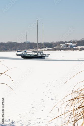 Sailboats on a frozen White Rock Lake in Dallas, Texas after severe winter weather. © JManaugh