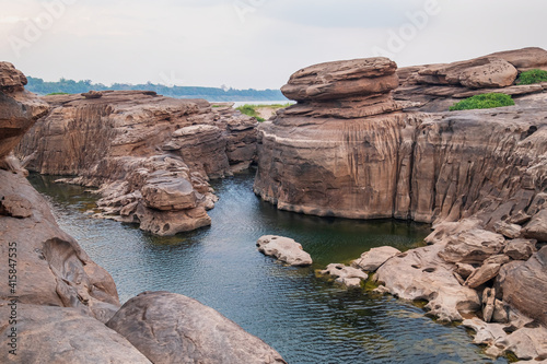 Three thousand waving the rocks beneath the Mekong river. Natural sandstone group Eroded through time for thousands of years. Ubon Ratchathani, Thailand