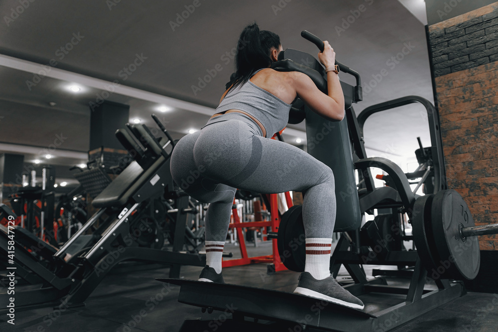 woman over thirty in the gym performs exercises under the guidance of an experienced woman trainer woman over thirty in the gym performs exercises under the guidance of an experienced woman trainer