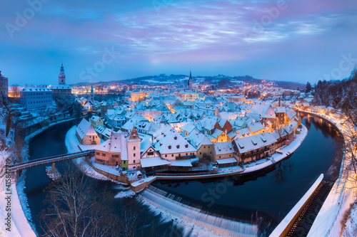 Fototapeta Naklejka Na Ścianę i Meble -  Panoramic view of Cesky Krumlov in winter season, Czech Republic. View of the snow-covered roofs. Travel and Holiday in Europe. Christmas time. Historical houses and streets. UNESCO World Heritage