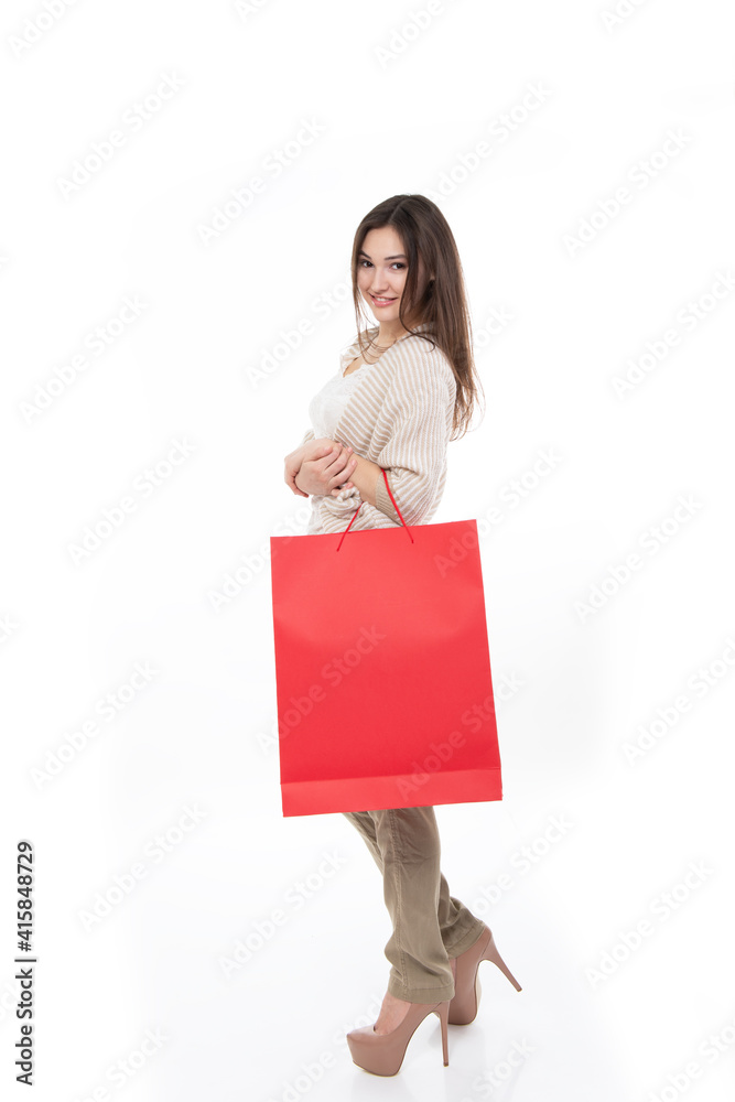 Happy young woman shopaholic with shopping bags at sale time, isolated on white background Happy young woman shopaholic with shopping bags at sale time, isolated on white background